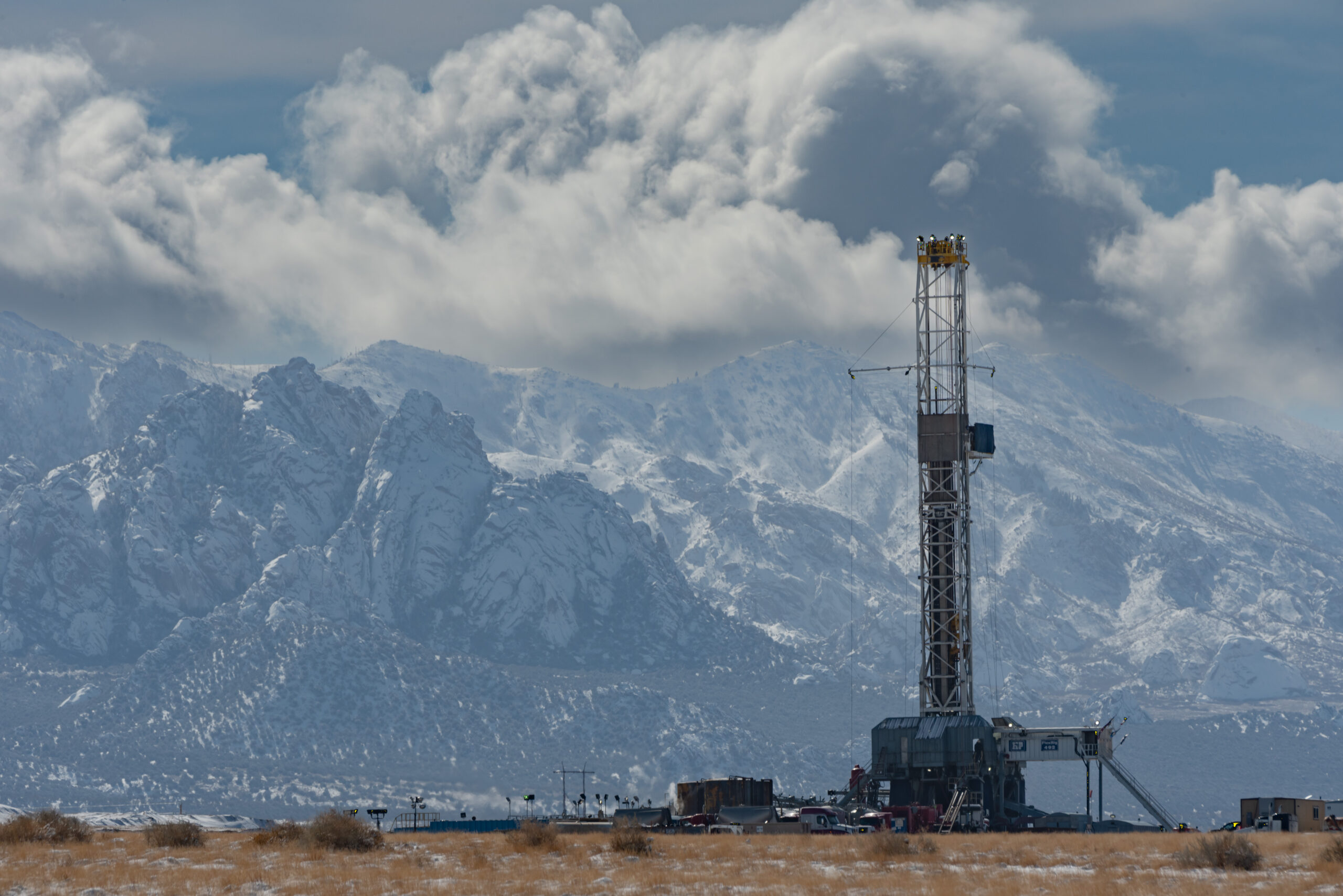 H&P FlexRig 492 drilling geothermal energy in Utah with the snowy Rocky Mountains in the background